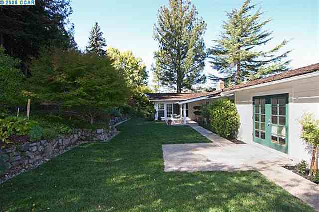 3527 Silver Springs Road Lafayette, CA 94549 - Photo 6 of 8 a front view of a house with a garden and trees