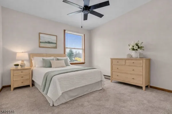 a living room with furniture and a sink