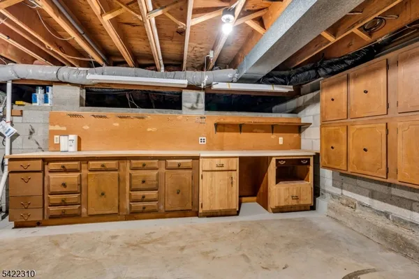 a view of a house with a wooden deck