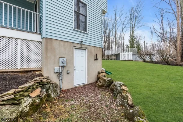 a view of a wooden deck with a yard