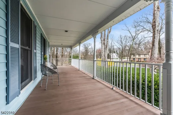 a view of an entryway with wooden floor and door
