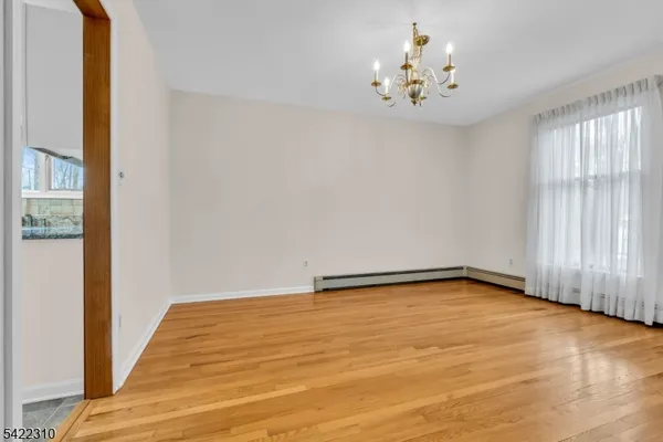 a kitchen with granite countertop a stove a sink and a refrigerator
