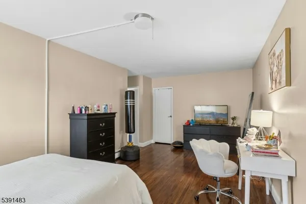 a bedroom with a bed and furniture