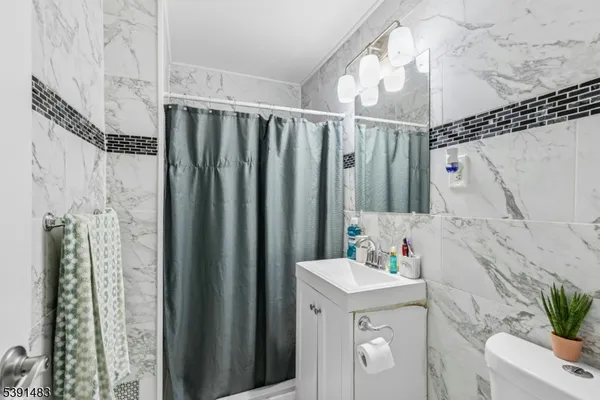 a bathroom with a sink a vanity and a mirror
