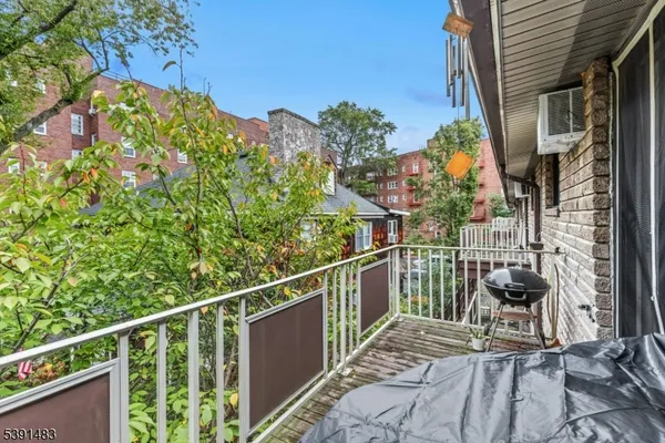 a view of a balcony with chairs