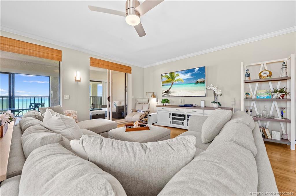 4651 Northeast Ocean Boulevard, Unit B26 Stuart, FL 34996 - Photo 11 of 35 a living room with furniture and a flat screen tv