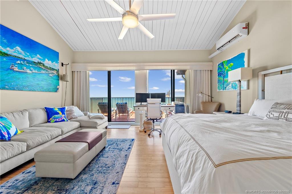 4651 Northeast Ocean Boulevard, Unit B26 Stuart, FL 34996 - Photo 22 of 35 a living room with furniture and a large window