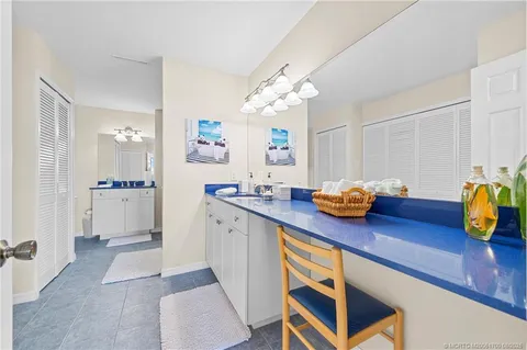 a kitchen with sink and cabinets