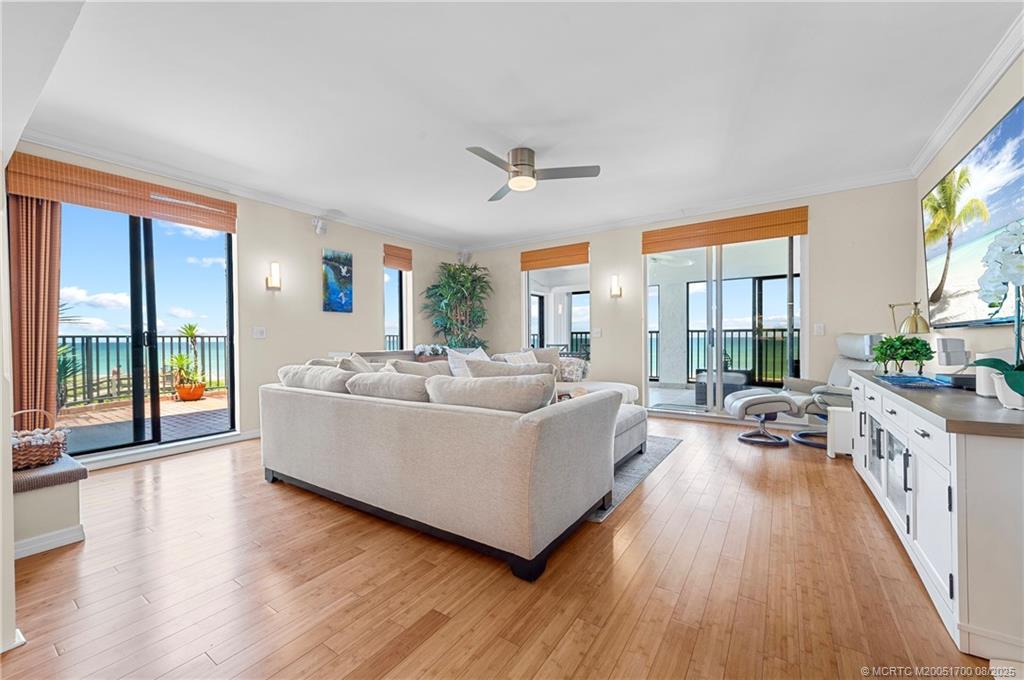 4651 Northeast Ocean Boulevard, Unit B26 Stuart, FL 34996 - Photo 3 of 35 a living room with furniture and a large window
