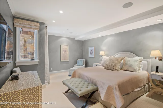 a bedroom with a bed and a couch