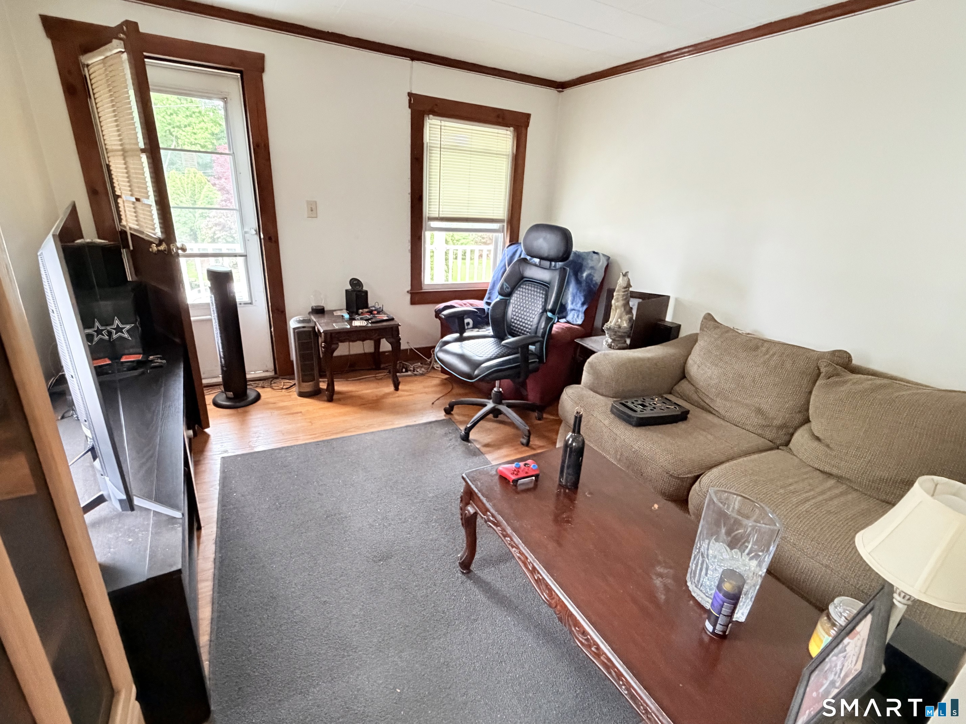 67 Pine Street Meriden, CT 06451 - Photo 15 of 34 a living room with furniture and a flat screen tv