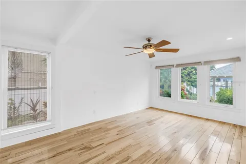 a bathroom with a sink toilet vanity and shower