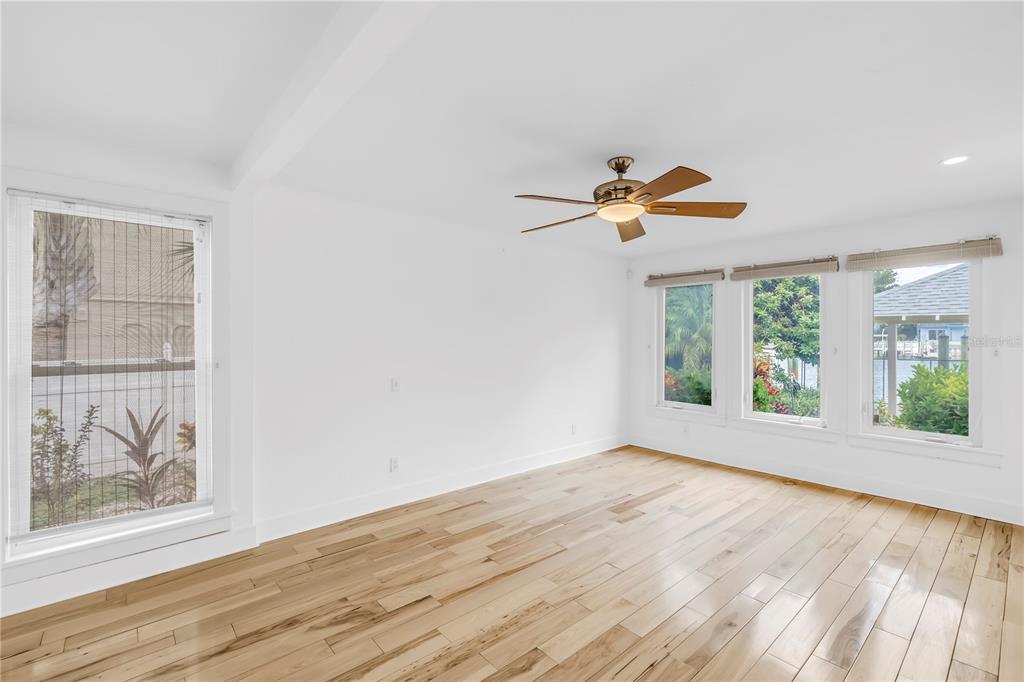 2605 Pass A Grille Way St. Pete Beach, FL 33706 - Photo 13 of 41 a view of an empty room with a window and wooden floor