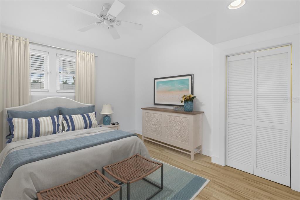 2605 Pass A Grille Way St. Pete Beach, FL 33706 - Photo 16 of 41 a bedroom with a bed and a window