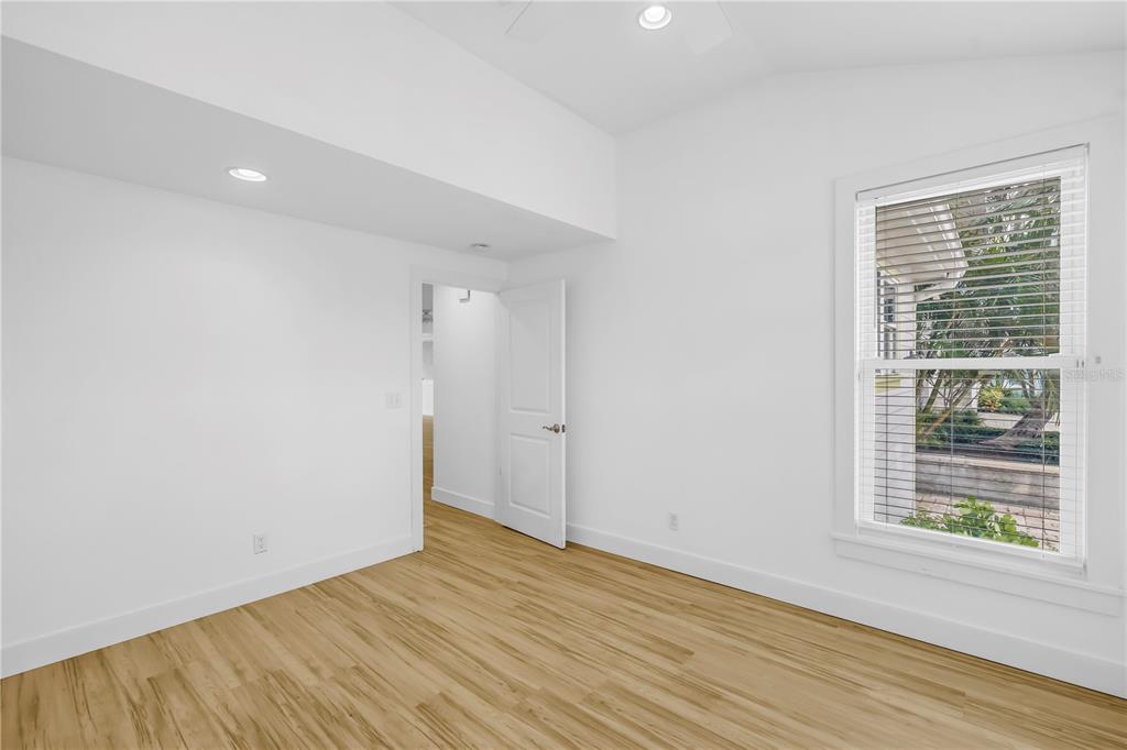 2605 Pass A Grille Way St. Pete Beach, FL 33706 - Photo 18 of 41 a view of an empty room with wooden floor and a window