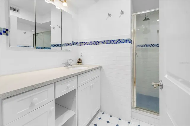 a lake view with a sitting space and large trees