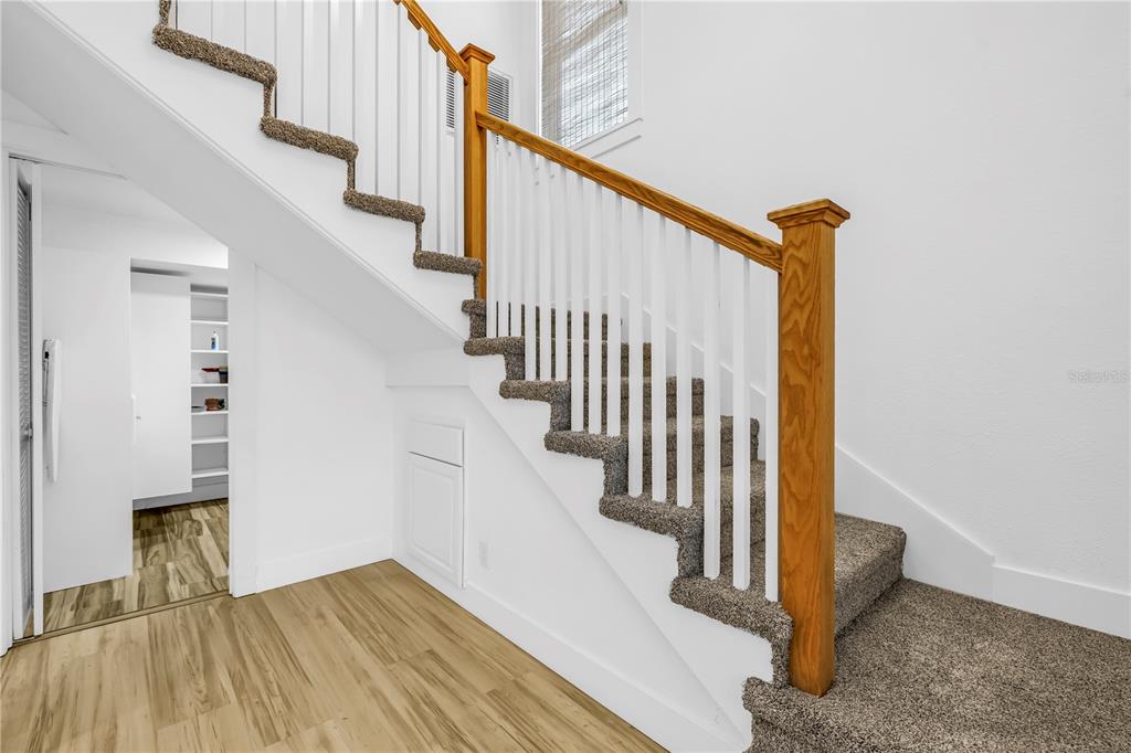 2605 Pass A Grille Way St. Pete Beach, FL 33706 - Photo 23 of 41 a view of entryway and hall with wooden floor