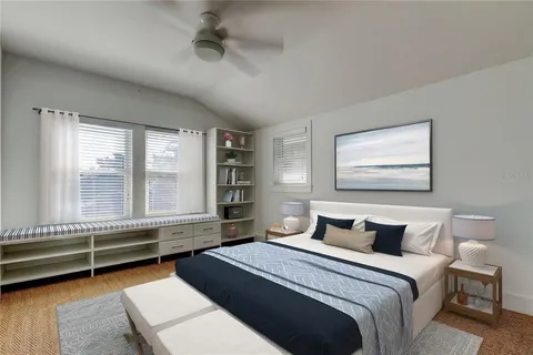 a view of a patio with table and chairs under an umbrella with potted plants
