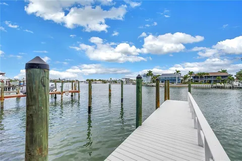 a front view of a building with small garden