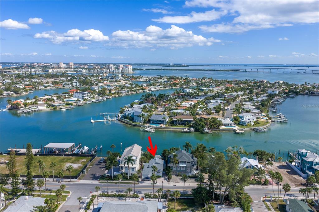 2605 Pass A Grille Way St. Pete Beach, FL 33706 - Photo 36 of 41 an aerial view of a city with lots of residential buildings ocean and mountain view in back
