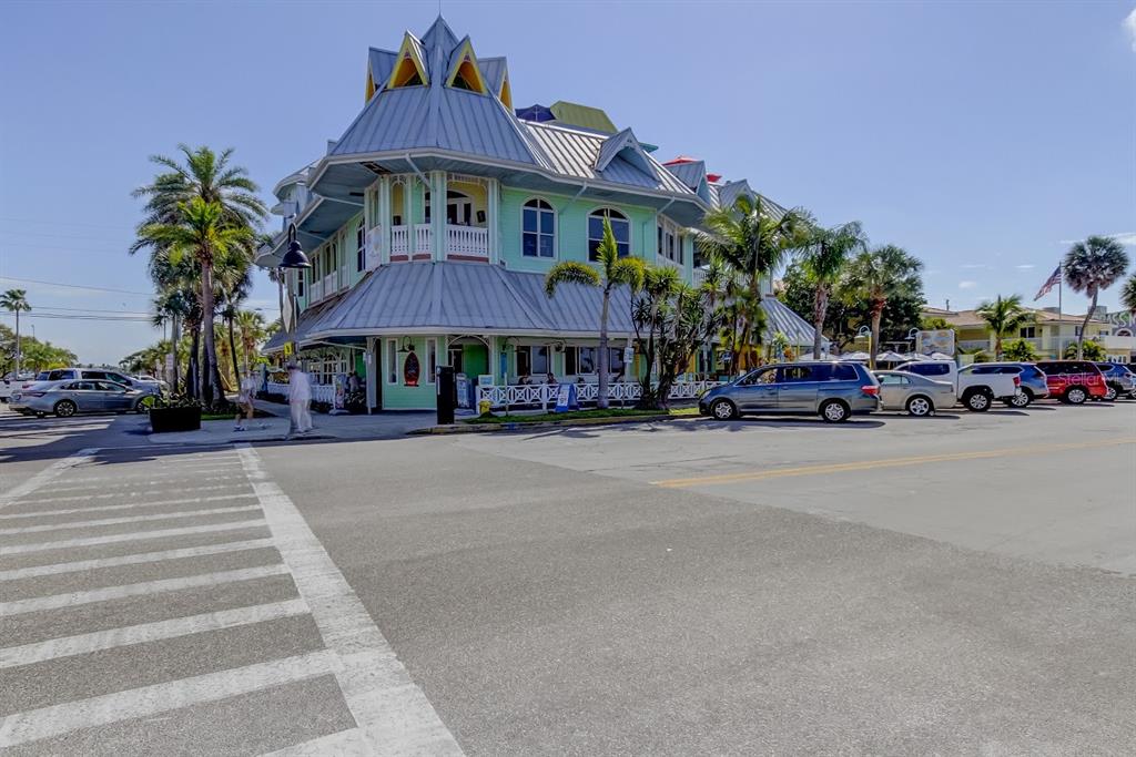 2605 Pass A Grille Way St. Pete Beach, FL 33706 - Photo 38 of 41 a front view of a building with small garden