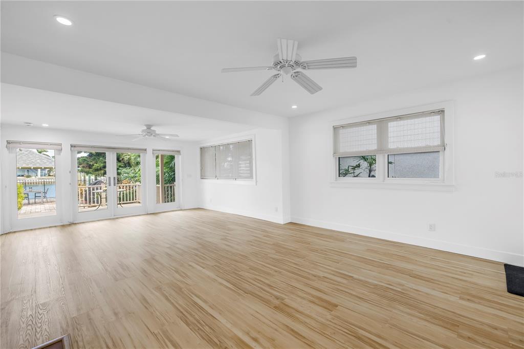 2605 Pass A Grille Way St. Pete Beach, FL 33706 - Photo 5 of 41 a view of an empty room with wooden floor and a window