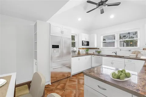 a kitchen with a stove and a sink