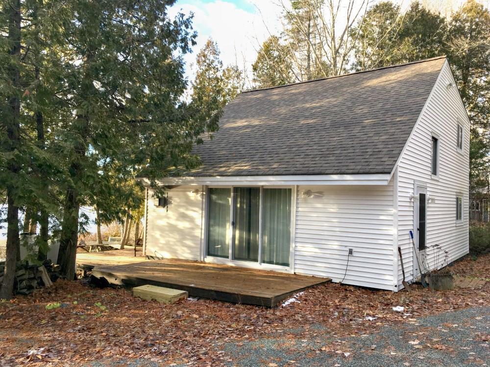 557 Phinney Farm Road Lincoln, ME 04457 - Photo 12 of 32 Side of home with sliding glass doors.