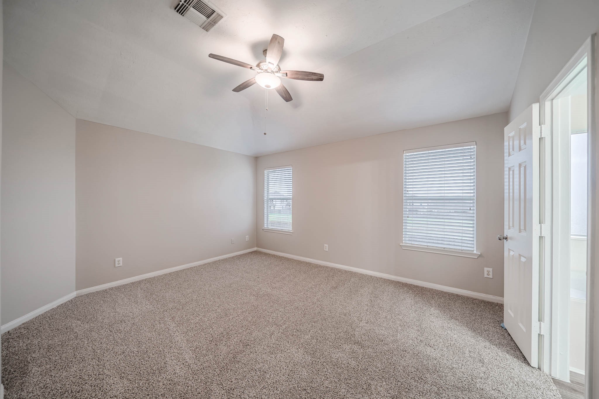 121 Rodeo Drive Manvel, TX 77578 - Photo 12 of 22 a view of an empty room with a window