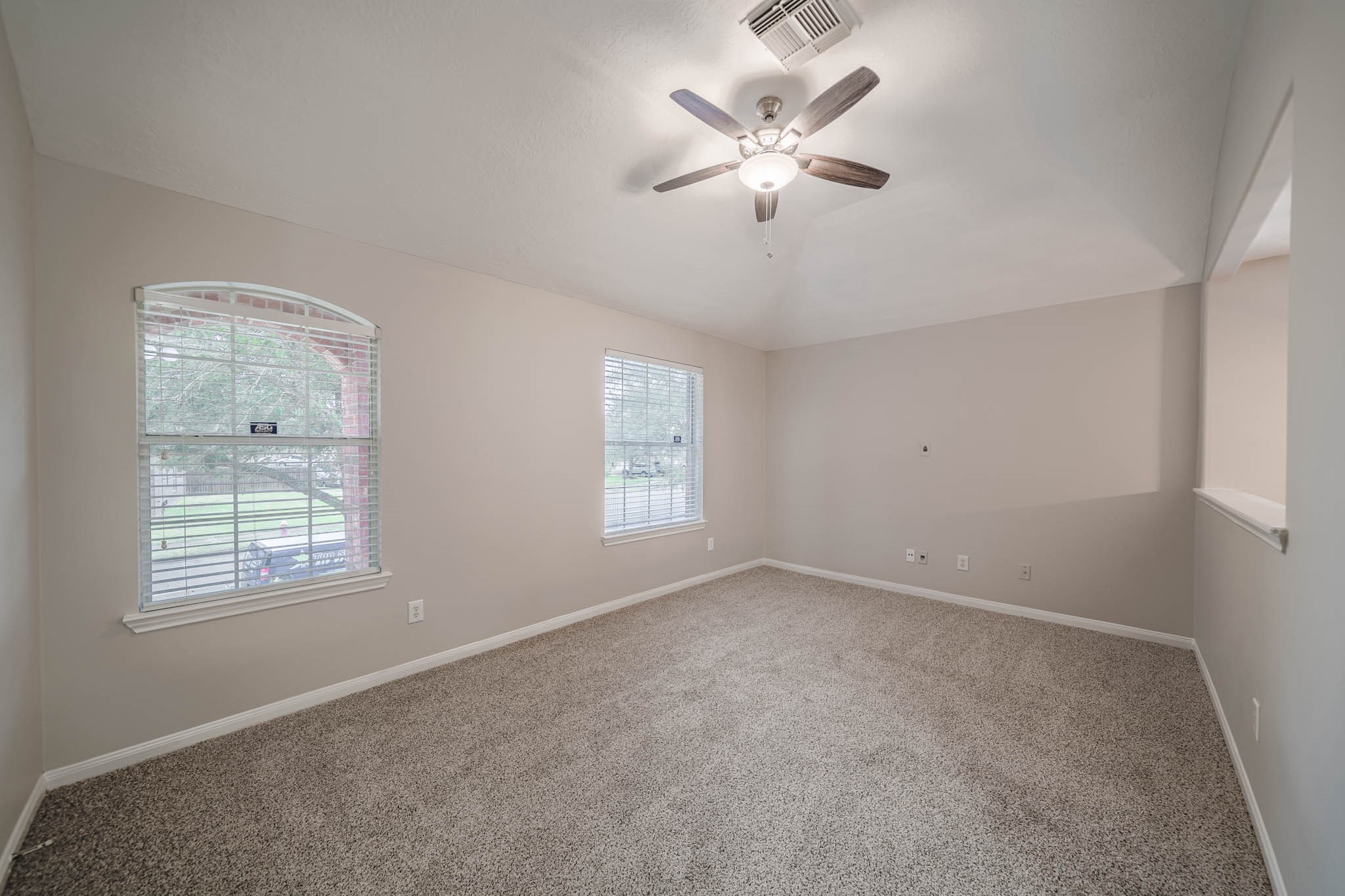121 Rodeo Drive Manvel, TX 77578 - Photo 15 of 22 a view of an empty room with a window