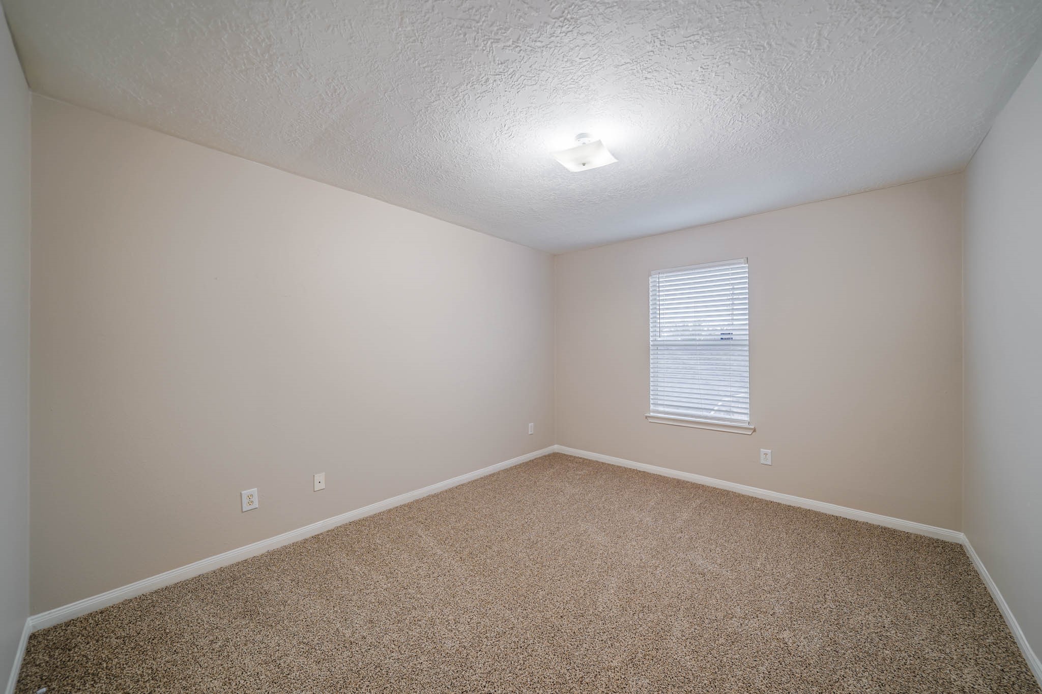 121 Rodeo Drive Manvel, TX 77578 - Photo 16 of 22 an empty room with a window