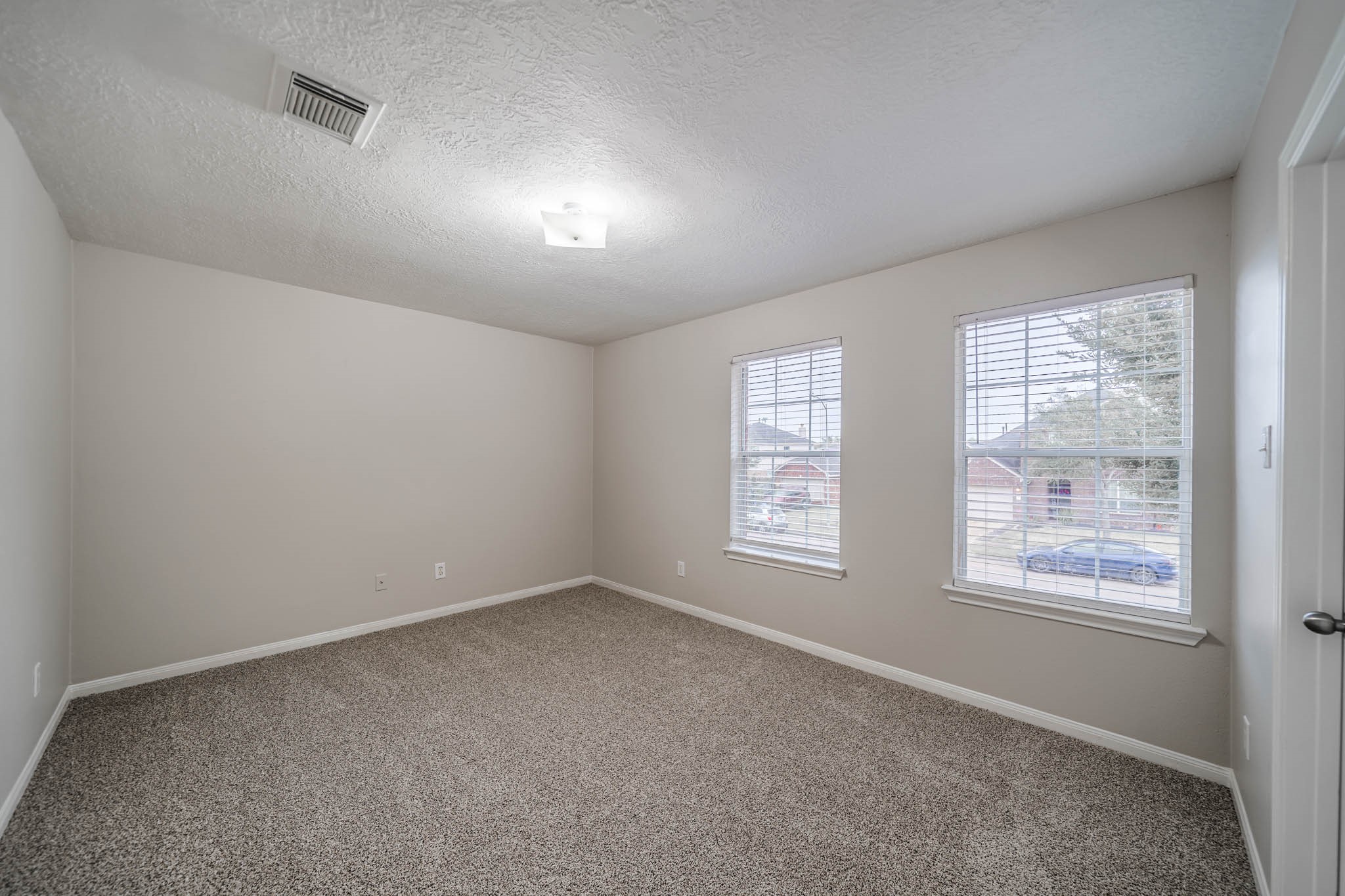 121 Rodeo Drive Manvel, TX 77578 - Photo 17 of 22 a view of an empty room with a window