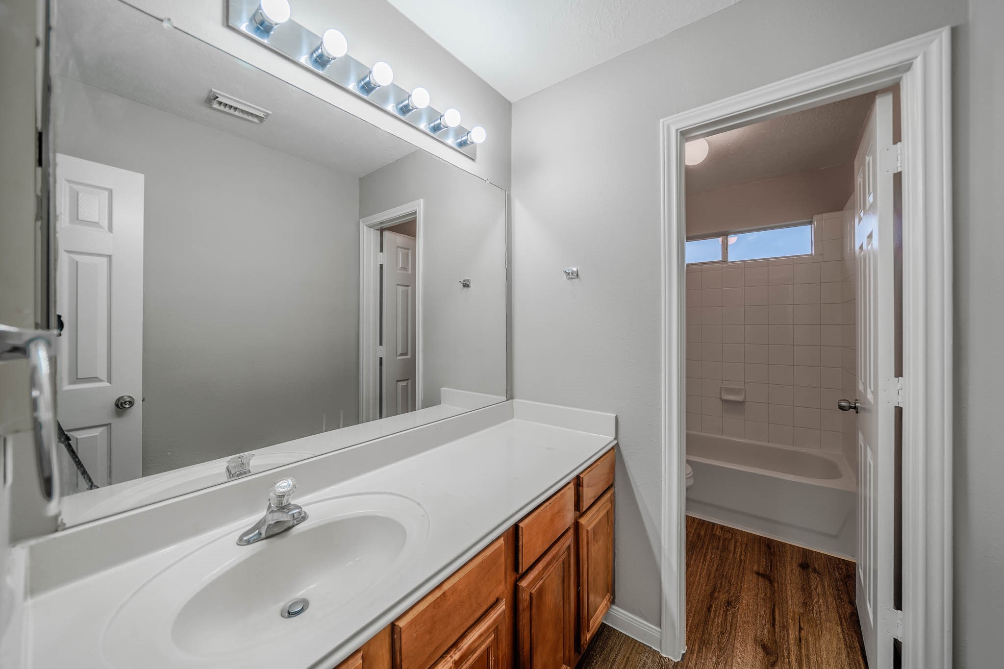 121 Rodeo Drive Manvel, TX 77578 - Photo 18 of 22 a bathroom with a sink and a mirror