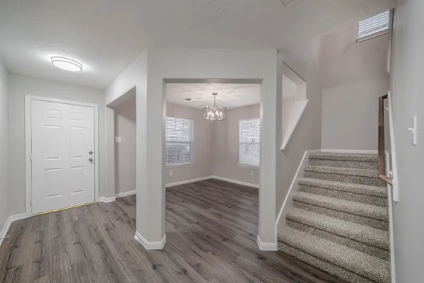 a view of entryway with wooden floor