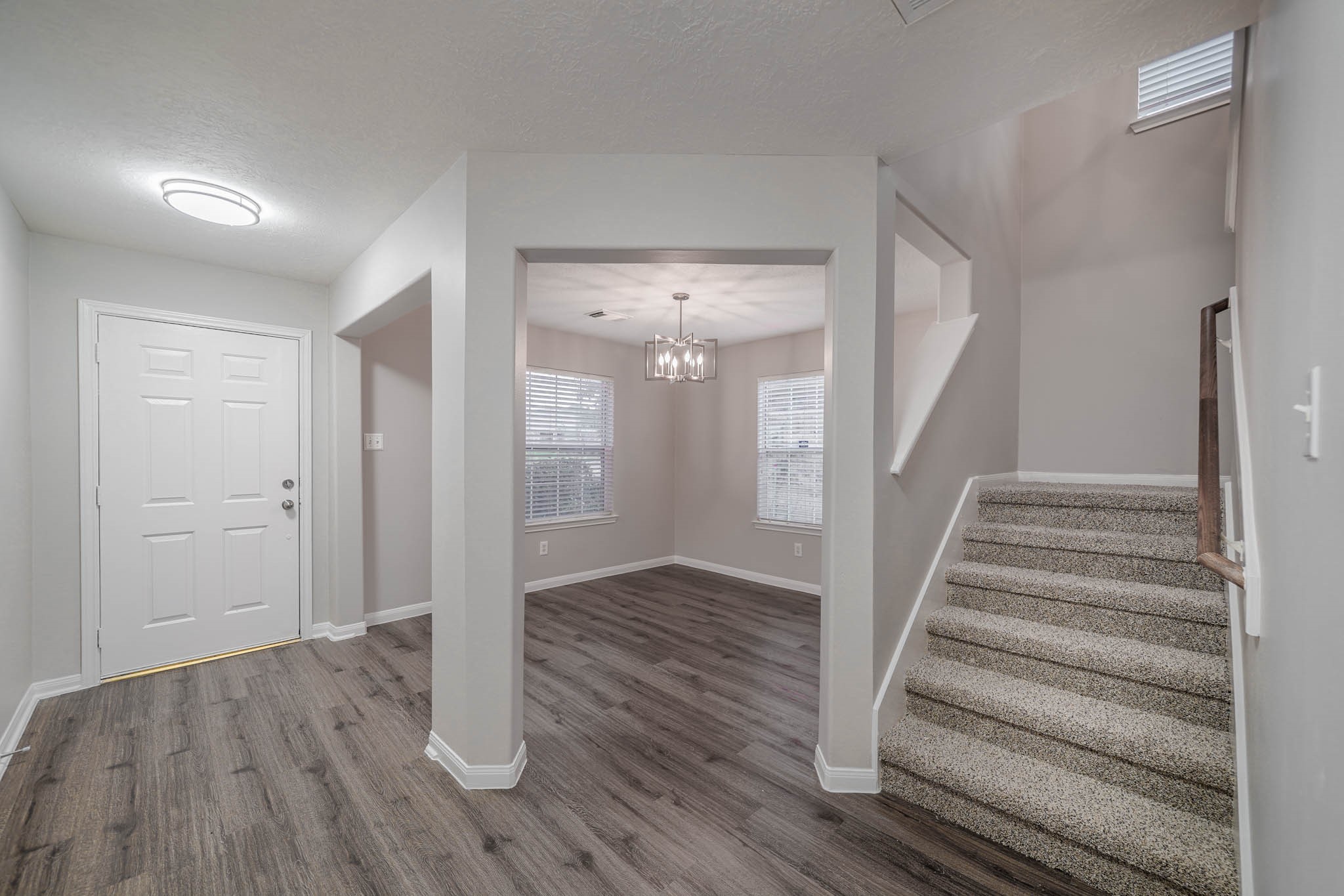 121 Rodeo Drive Manvel, TX 77578 - Photo 3 of 22 a view of entryway with wooden floor