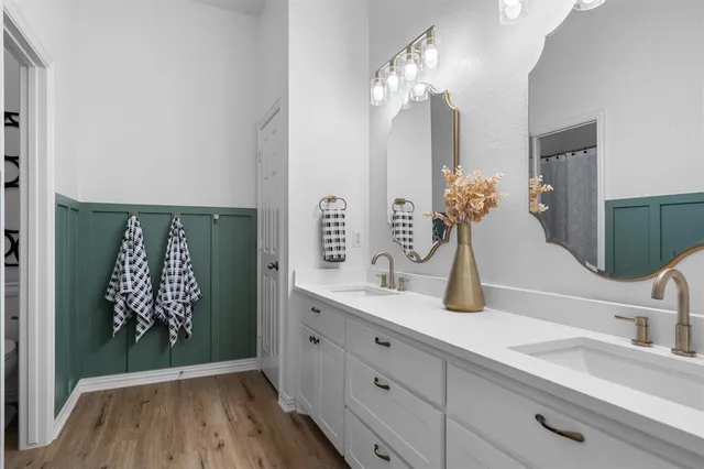 a bathroom with a sink and mirror