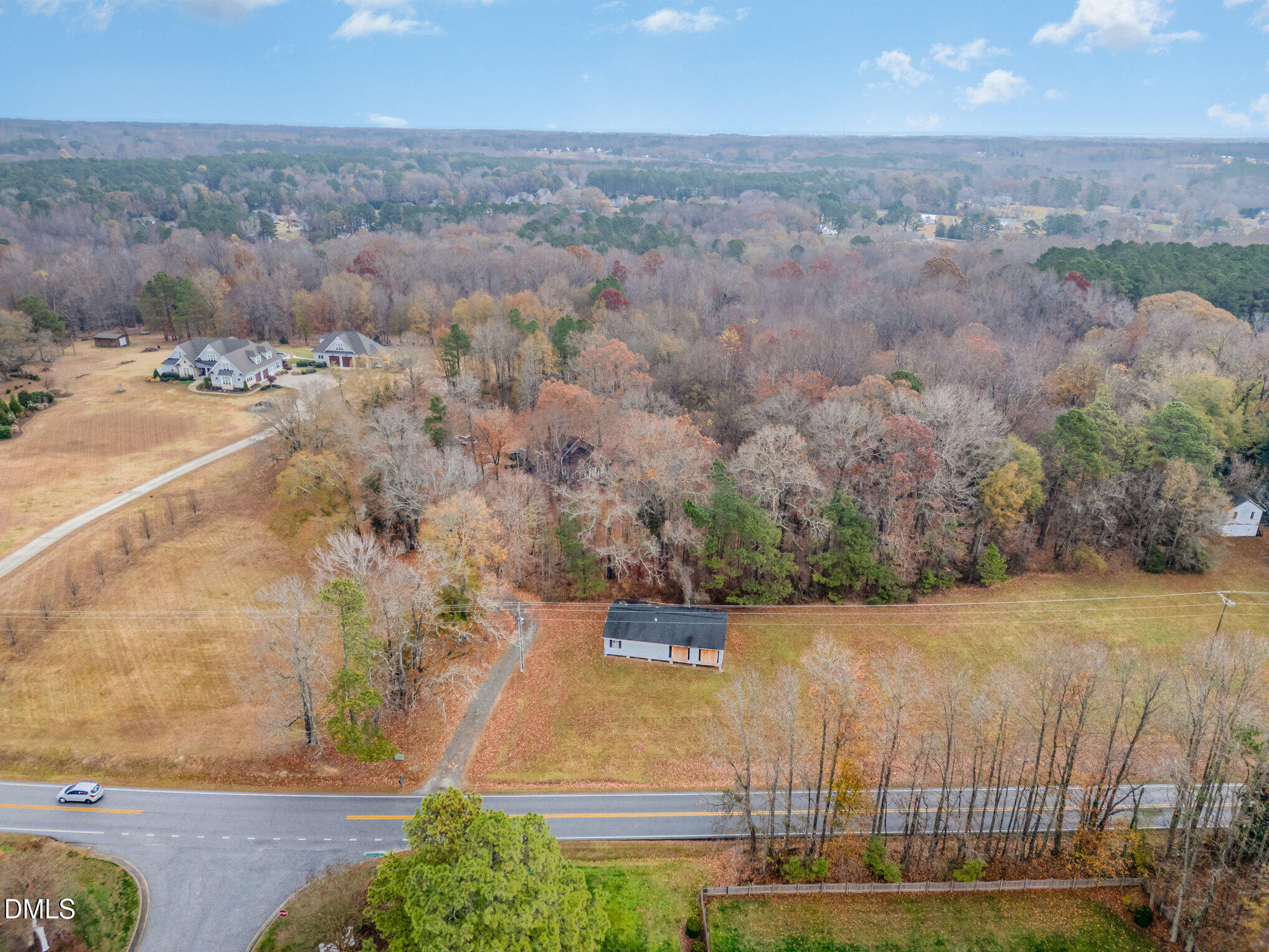 6801 Rock Service Station Road Raleigh, NC 27603 - Photo 20 of 36 an aerial view of a house with a yard