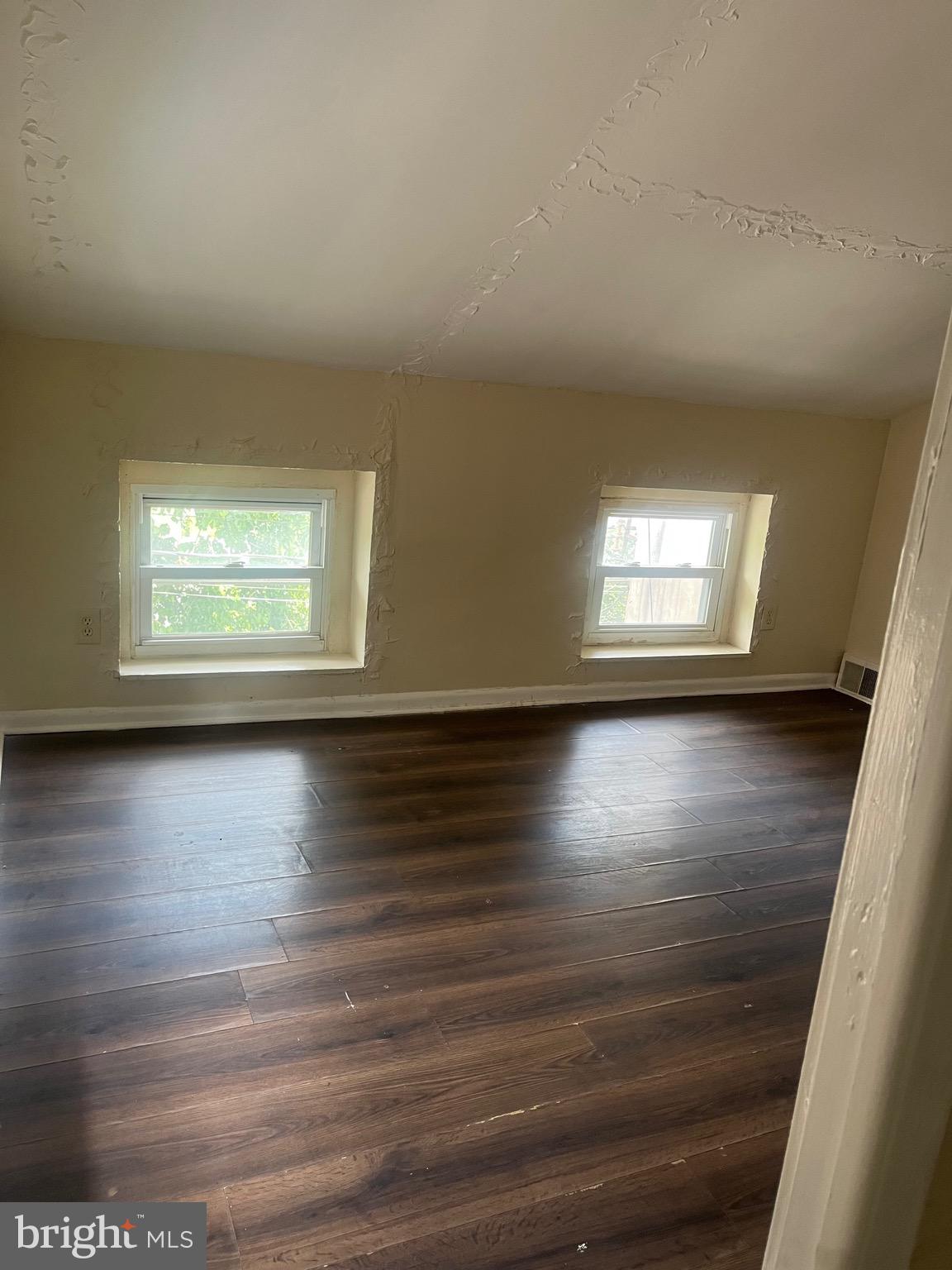 405 East Rittenhouse Street Philadelphia, PA 19144 - Photo 9 of 12 a view of empty room with window and wooden floor
