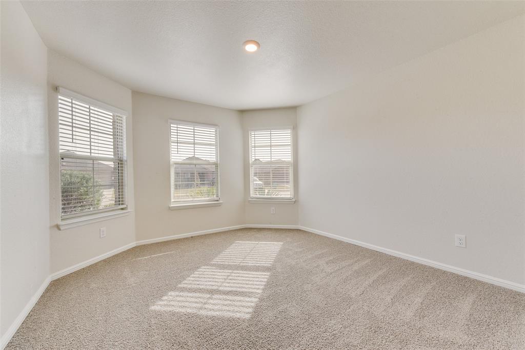 711 Durango Lane Cleburne, TX 76033 - Photo 17 of 26 a view of an empty room with a window