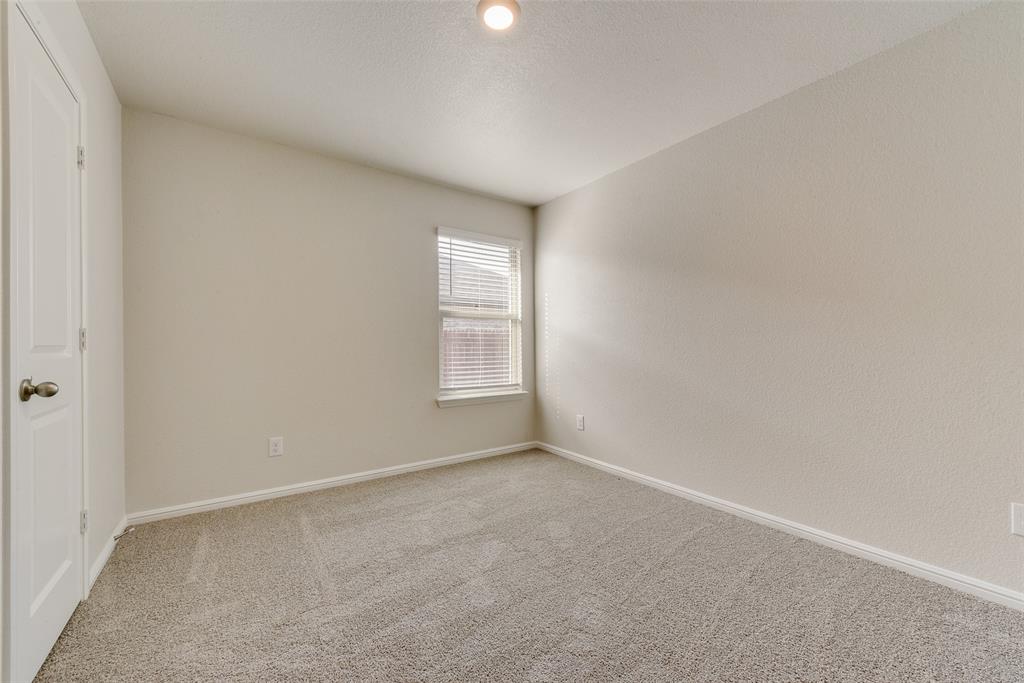 711 Durango Lane Cleburne, TX 76033 - Photo 18 of 26 an empty room with windows