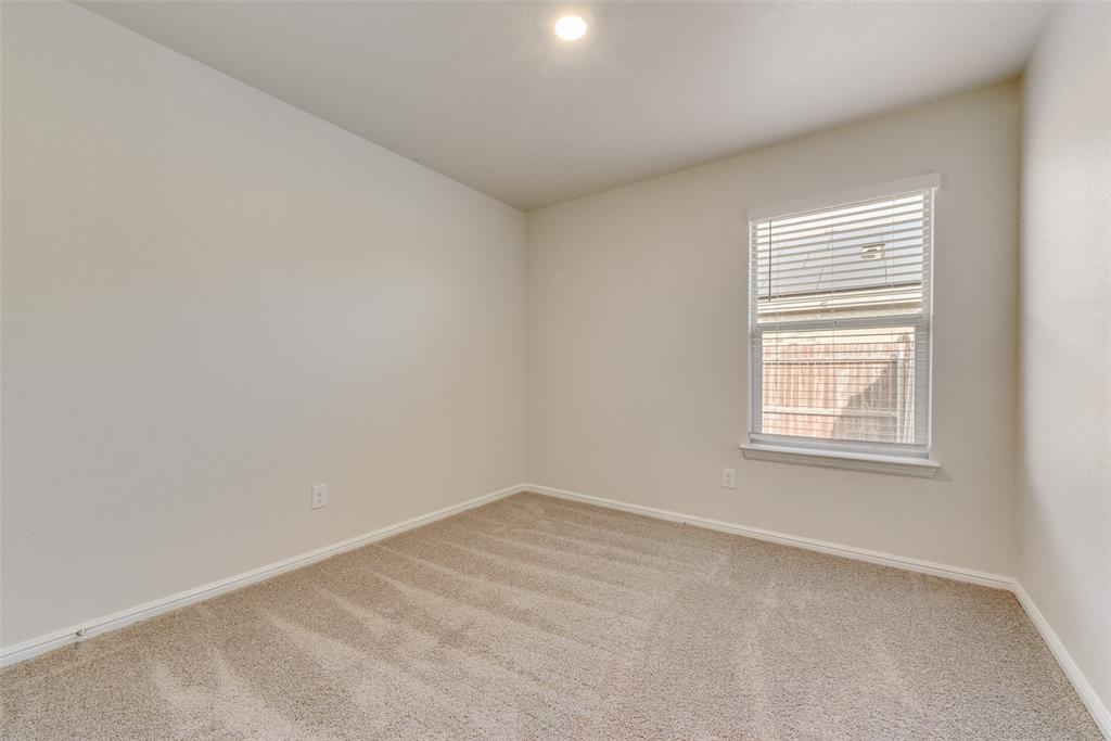 711 Durango Lane Cleburne, TX 76033 - Photo 20 of 26 an empty room with a window