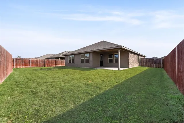 a backyard of a house with lots of green space