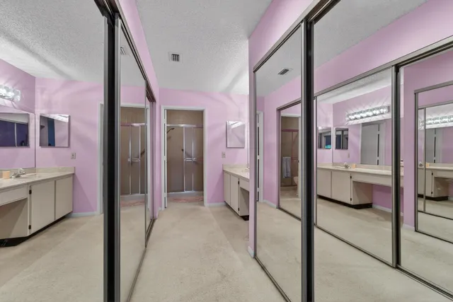 a view of a bathroom with a tub and shower