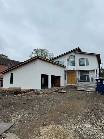 a front view of a house with parking space