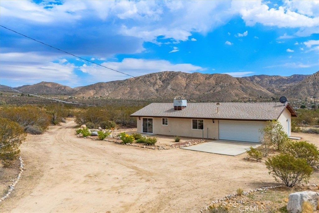 8887 Little Morongo Road Morongo Valley, CA 92256 - Photo 1 of 1 front view of a house with a yard