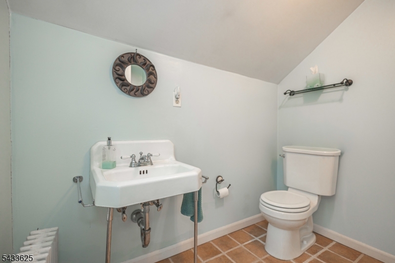 449 Stamets Road Milford, NJ 08848 - Photo 31 of 44 a bathroom with a toilet a sink and mirror