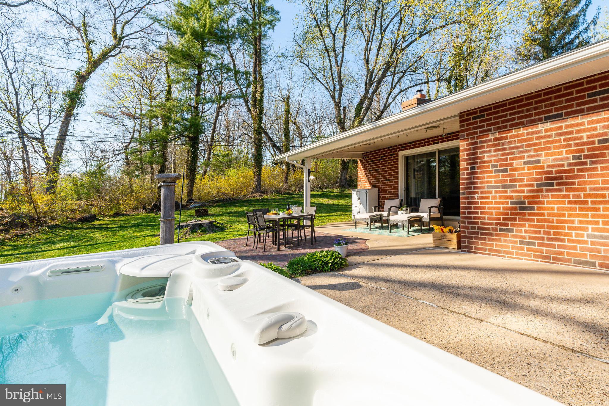 709 Alene Road Ambler, PA 19002 - Photo 31 of 42 a view of a patio with couches and table and chairs and garden