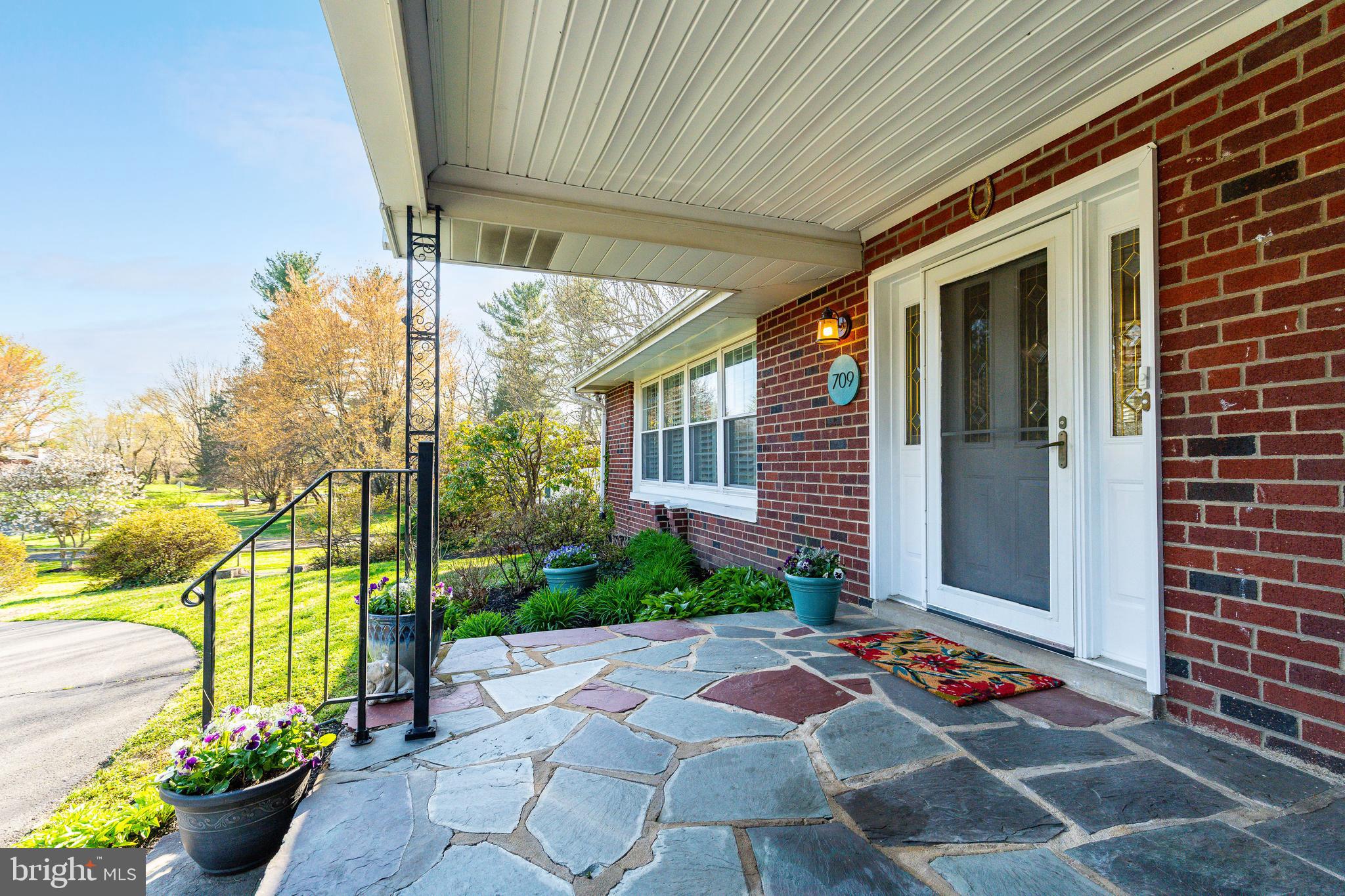 709 Alene Road Ambler, PA 19002 - Photo 36 of 42 a front view of a house with a garden