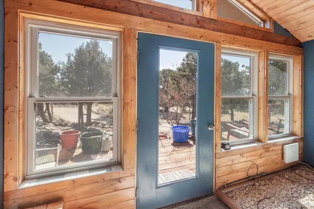 a view of a room that has a large window