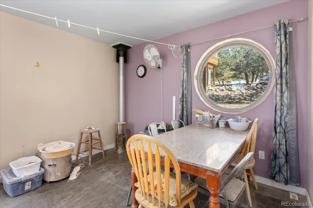 a bathroom with a granite countertop toilet a mirror and a sink